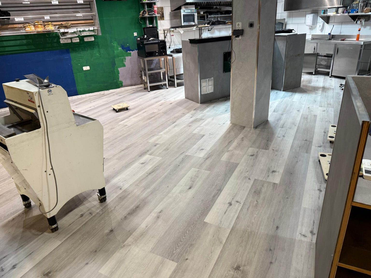 LVT flooring installation during the overnight bakery project